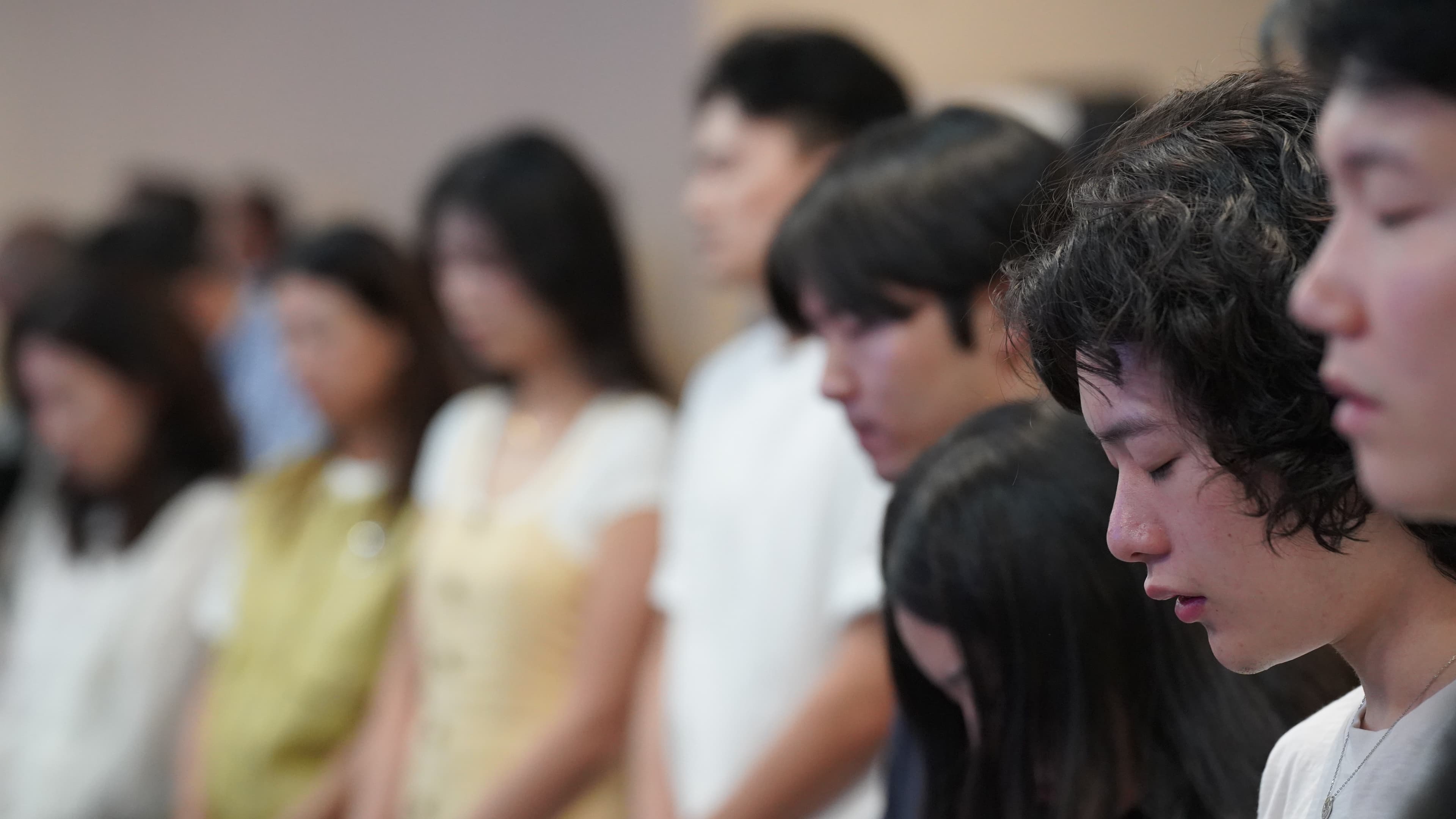 congregation members praying